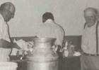 Sam Pearson, Hjalmer Hanson, and Andrew Anderson cleaning up the kitchen in 1979